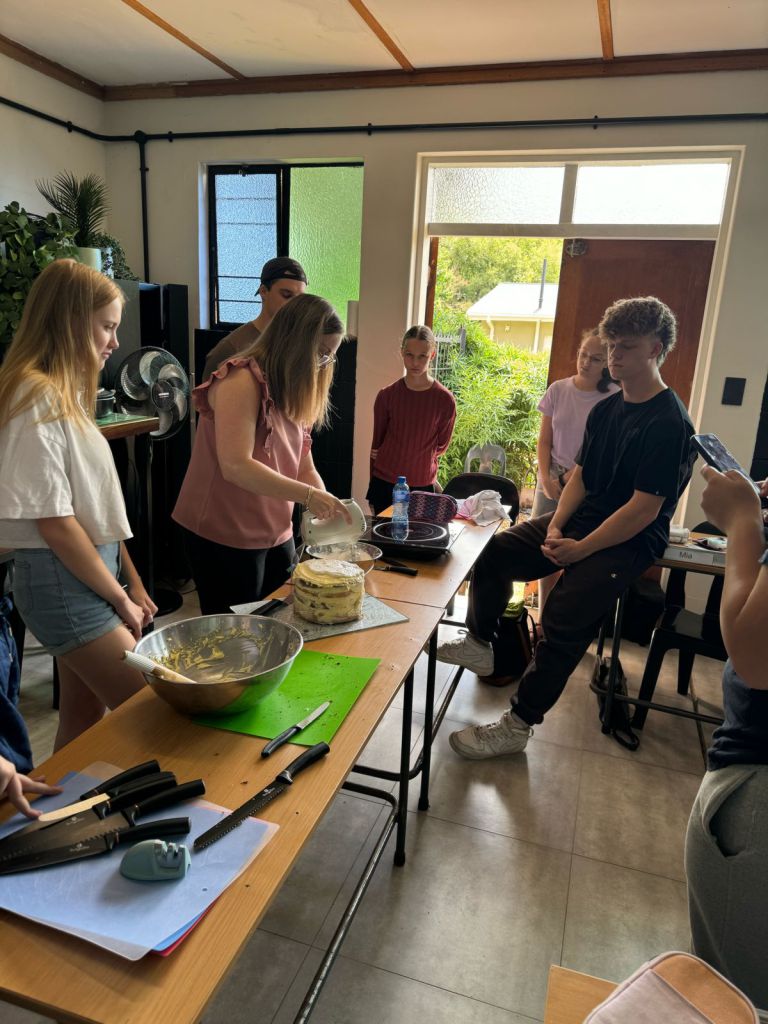 Equilibria student stirring food during a practical cooking activity